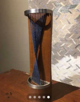 Totem sculpture with indigo yarn weave