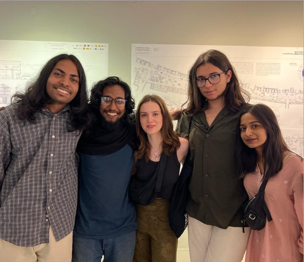 Workshop team in front of the Learning from Puran Dhaka panels